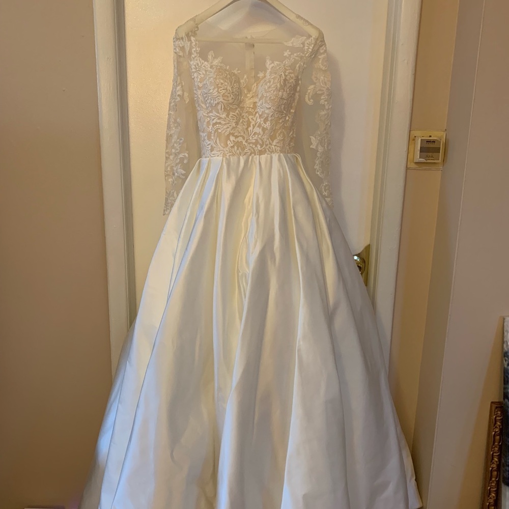 Wedding gown with long sleeves and lace details